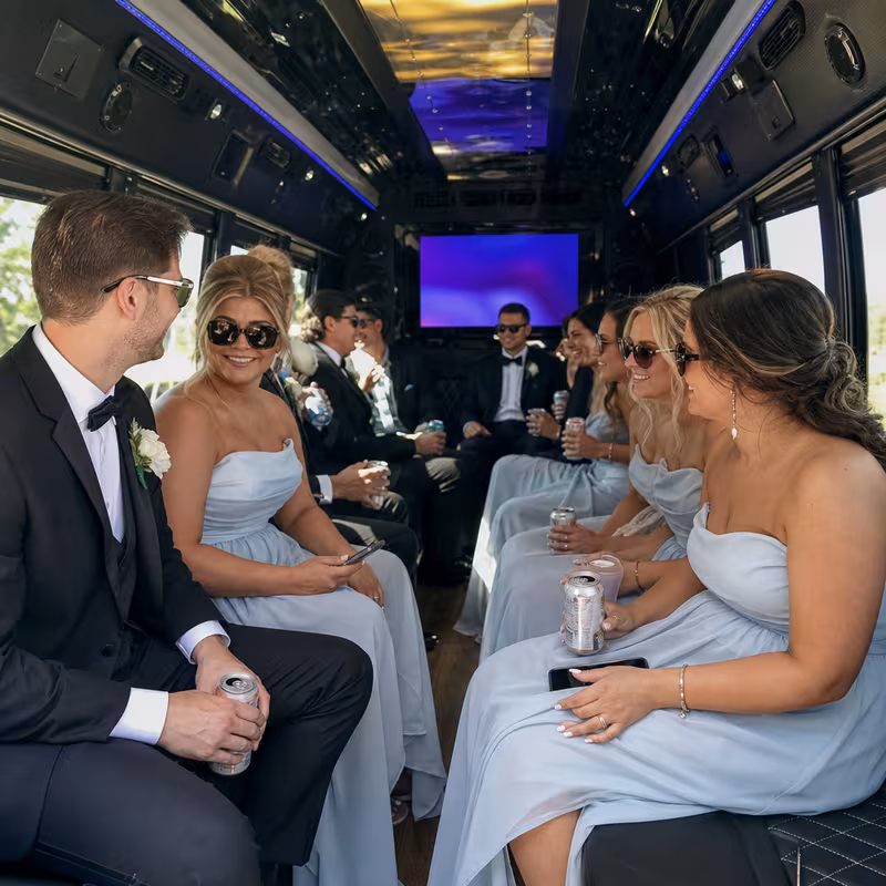 Wedding guests seated inside a Myrtle Beach party bus