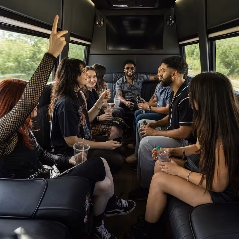 Group boarding a white charter bus for Concert Transportation transportation in Myrtle Beach
