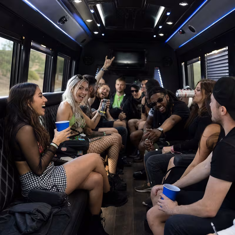Passengers loading luggage while boarding an Myrtle Beach group shuttle