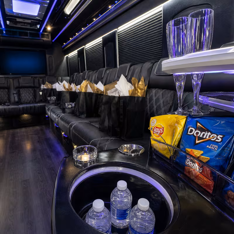 Party bus interior with wraparound leather seating and LED lighting in Myrtle Beach
