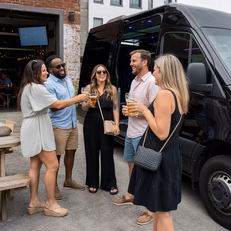Passengers loading luggage while boarding an Myrtle Beach group shuttle
